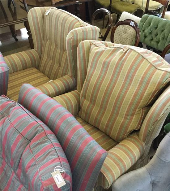 Pair of modern easy wingback chairs covered in striped fabric